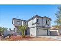 Charming two-story home with a well-maintained front yard and an attached two-car garage at 3871 Trellis View Ave, Las Vegas, NV 89115
