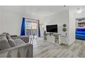 Living room features hardwood floors, bright natural light, and a view to the bedroom at 4200 S Valley View Blvd # 1120, Las Vegas, NV 89103