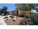 Charming single-story home with stone accents, desert landscaping, and a two-car garage at 4732 S Adriano Way, Pahrump, NV 89061
