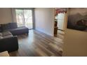 Bright living room with modern flooring, a sliding glass door to the patio, and comfortable seating at 5000 Indian River Dr # 483, Las Vegas, NV 89103