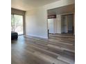 Open concept living room features plank flooring and access to the kitchen at 5000 Indian River Dr # 483, Las Vegas, NV 89103