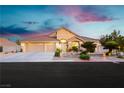 Charming single-Gathering home features a three-car garage, desert landscaping, and a tile roof at 6617 Golden Bit Ave, Las Vegas, NV 89131
