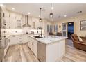 Bright kitchen featuring stainless steel appliances, a spacious island, and stylish pendant lighting at 8149 Villa De La Playa St, Las Vegas, NV 89131