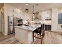 Beautiful kitchen with granite countertops, stainless steel appliances, and a large island at 8149 Villa De La Playa St, Las Vegas, NV 89131