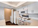 Bright kitchen features white cabinets, stainless steel appliances and eat-in counter at 8600 W Charleston Blvd # 1059, Las Vegas, NV 89117