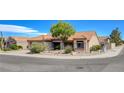 Charming one-story home with desert landscaping, tile roofing, and a two-car garage at 9337 Quail Ridge Dr, Las Vegas, NV 89134