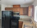 Functional kitchen boasts modern appliances, ample counter space, and stylish cabinets for efficient living at 1220 Toledo St, Henderson, NV 89015