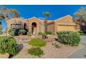 Beautiful home boasting mature landscaping, desert rock, and a quaint walkway leading to the front door at 1904 Hot Oak Ridge St, Las Vegas, NV 89134