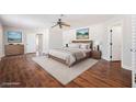 Spacious main bedroom with hardwood floors, neutral walls, and generous closet space, creating a serene retreat at 209 Camino Vista St, Henderson, NV 89012