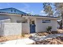 Charming one-story home featuring a cozy gated front entrance and desert landscaping at 2124 Willowbury Dr # D, Las Vegas, NV 89108
