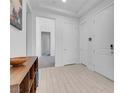 Bright foyer with wood floors and white walls and white doors at 369 Old Erie Pl, Henderson, NV 89011
