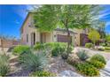 Attractive exterior view featuring desert landscaping, a brick-paved driveway, and a covered porch at 3949 Amanda Bay Ave, North Las Vegas, NV 89081