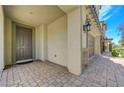 Inviting front entry with a covered porch and a view of the garage with stone facade at 3949 Amanda Bay Ave, North Las Vegas, NV 89081