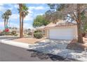 Attractive single-story home with a two-car garage, surrounded by well-kept landscaping at 4516 Cielo Ln, Las Vegas, NV 89130