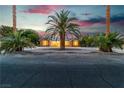 Inviting single-story home with desert landscaping, palm trees, and brick facade at 5486 Alfred Dr, Las Vegas, NV 89108