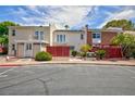 Two-story townhome with a cozy porch and well-maintained landscaping at 572 Tam O Shanter, Las Vegas, NV 89109