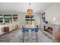 Bright dining area with modern furniture and a stylish pendant light fixture at 605 Cadence Vista Dr, Henderson, NV 89011