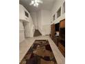 Entryway featuring tiled floor, stairway and high ceilings at 6363 Berry Patch Way, Las Vegas, NV 89142