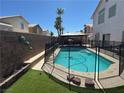 Inviting backyard pool surrounded by a safety fence, complemented by a gazebo for outdoor enjoyment at 6363 Berry Patch Way, Las Vegas, NV 89142