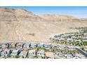 Expansive aerial view of the neighborhood with mountain views at 6433 Farness St, Las Vegas, NV 89135