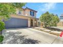 Charming two-story home with stucco exterior, tiled roof, and well-maintained landscaping at 10343 Beallsville St, Las Vegas, NV 89141