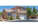 Beautiful two-story house with a well-manicured lawn and a welcoming front entrance at 10352 Natural Springs Ave, Las Vegas, NV 89129