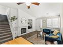 Bright living room features a cozy fireplace, built-in shelves, and comfortable seating at 10352 Natural Springs Ave, Las Vegas, NV 89129