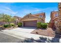 Charming two-story home with a well-maintained front yard and a spacious two-car garage at 1228 Swanbrooke Dr, Las Vegas, NV 89144
