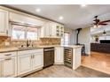 Beautiful kitchen with stainless steel appliances, granite countertops, a wine fridge, and hardwood flooring at 12992 State Hwy 160, Las Vegas, NV 89161