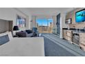 Inviting living room boasts expansive views from the large window, comfortable seating, and a kitchenette at 145 E Harmon Ave # 3705, Las Vegas, NV 89109