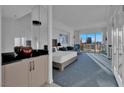 Bright main bedroom features modern decor, a large window with a view, and an adjacent kitchenette area at 145 E Harmon Ave # 3705, Las Vegas, NV 89109