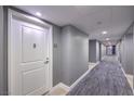 Modern hallway featuring neutral colors, geometric carpeting, and recessed lighting at 200 W Sahara Ave # 2210, Las Vegas, NV 89102