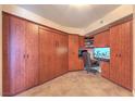 Office room with custom built-in storage, desk, and tiled flooring at 200 W Sahara Ave # 2210, Las Vegas, NV 89102