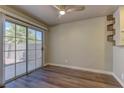 Bright dining area with sliding glass doors to the yard and wood-look flooring at 278 Star Cluster Cir, Las Vegas, NV 89145