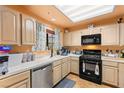 Functional kitchen featuring wooden cabinets, stainless steel appliances, and a black gas range at 2851 S Valley View Blvd # 1071, Las Vegas, NV 89102