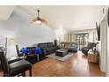 Spacious living room featuring tile floors, a ceiling fan, comfortable furniture, and natural light at 2851 S Valley View Blvd # 1071, Las Vegas, NV 89102