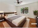 Comfortable bedroom featuring a king-sized bed, hardwood flooring, and lots of natural light at 3053 Monroe Park Rd, Henderson, NV 89052