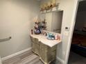 Well-lit bathroom with a vanity that offers storage and a large mirror at 3447 One Nation Ave, Las Vegas, NV 89121