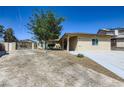 Charming single-story home featuring xeriscaping, a gated entrance, and a well-maintained lawn at 3557 Wayne Cir, Las Vegas, NV 89121