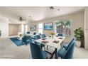 Bright dining room with views to the living room, modern furnishings, and natural light at 3640 Shanagolden St, Las Vegas, NV 89129