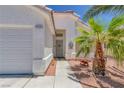 Inviting front entrance with a charming exterior and mature landscaping for added curb appeal at 4420 Loma Ct, Las Vegas, NV 89130