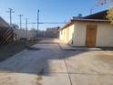 Shows the back exterior of the home and driveway at 4430 Judson Ave, Las Vegas, NV 89115