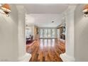 Elegant living room showcasing hardwood floors, fireplace, and large windows for natural light at 5224 Painted Lakes Way, Las Vegas, NV 89149
