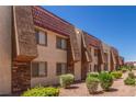 Beautiful apartment complex featuring lovely exteriors with desert landscaping and well-maintained grounds at 5301 River Glen Dr # 205, Las Vegas, NV 89103