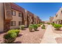 Beautiful apartment complex featuring lovely exteriors with desert landscaping and well-maintained grounds at 5301 River Glen Dr # 205, Las Vegas, NV 89103