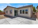 Concrete patio space with sliding glass doors leading into the home at 5908 Big Horn View St, North Las Vegas, NV 89031
