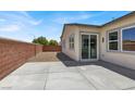 A backyard with concrete patio and a brick wall, perfect for outdoor entertaining at 5908 Big Horn View St, North Las Vegas, NV 89031