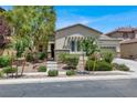 Inviting single-story house with desert landscaping and a stone-accented facade at 5908 Big Horn View St, North Las Vegas, NV 89031
