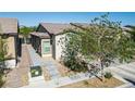 Inviting single-story home with desert landscaping, brick walkway and a single-car garage at 7472 Brody Meadows St, North Las Vegas, NV 89084