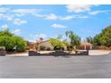 Charming home featuring mature trees, well-maintained landscaping, and a three-car garage at 9385 Mohawk St, Las Vegas, NV 89139